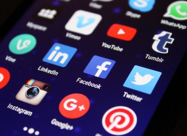 Social media app logos displayed on a phone screen